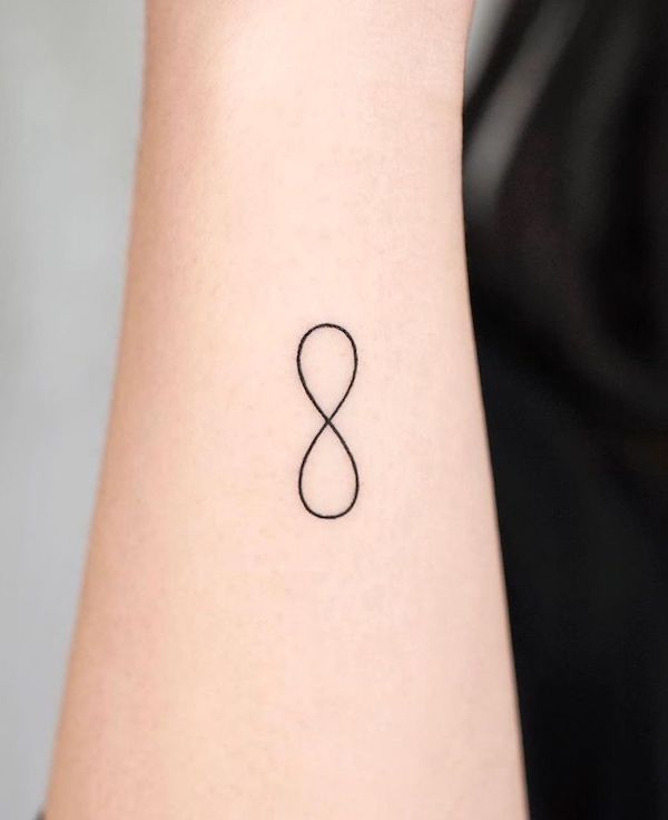 Small infinity side wrist tattoo by @simya_tattoo