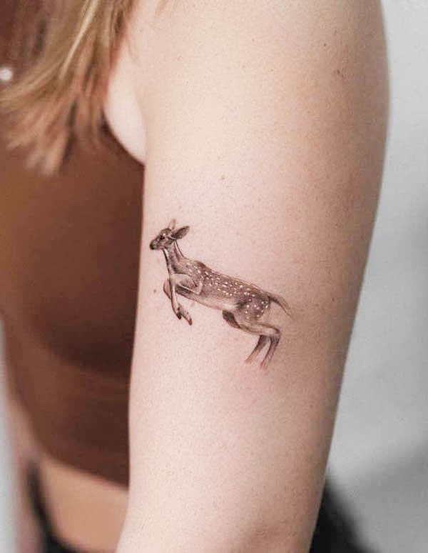 Small leaping deer tattoo by @nerostattoo