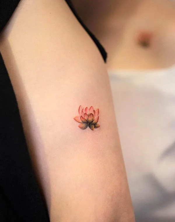 Small lotus tattoo by @handitrip