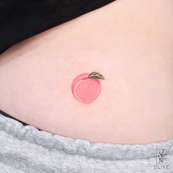 Small peach tattoo by @tattoo_artist_olive