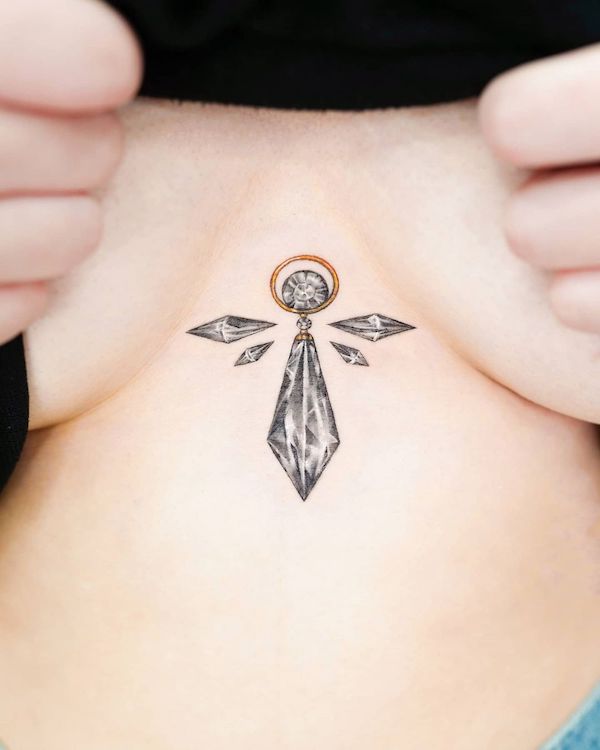 Small pendant between the boobs tattoo by @needsyou_tattoo