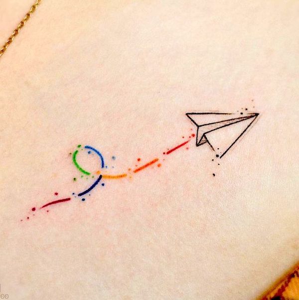 Small rainbow paper plane tattoo by @minie._.chan_