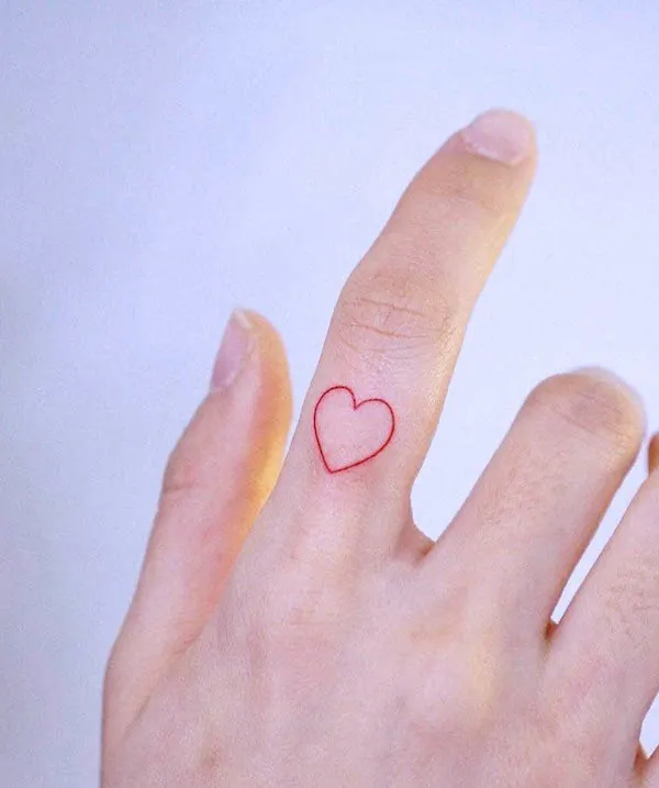 Small red heart finger tattoo by @inkedout_tattoo