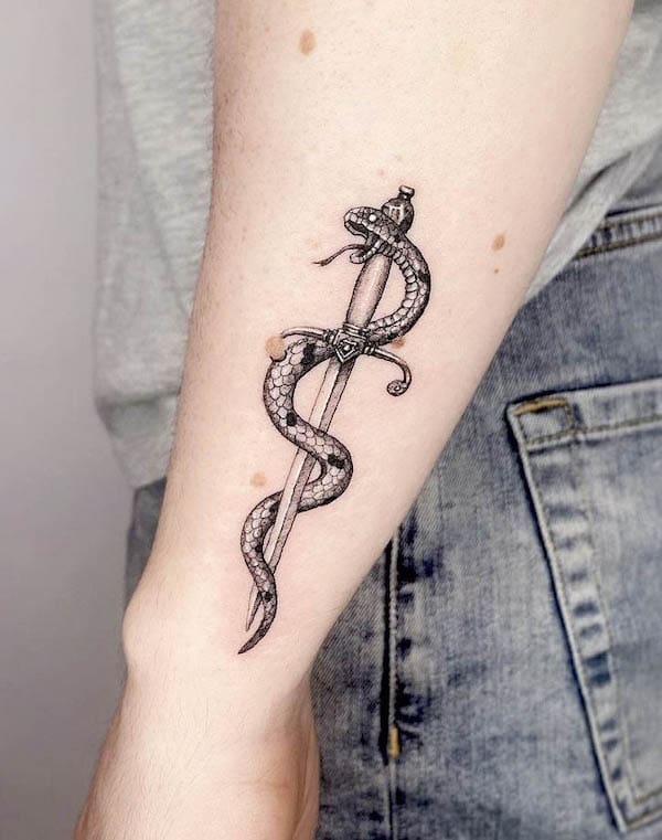 Snake and dagger wrist tattoo by @beckydonnellytattoo