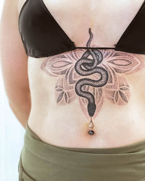 Snake and mandala sternum tattoo by @tattoos.by_.aggy_