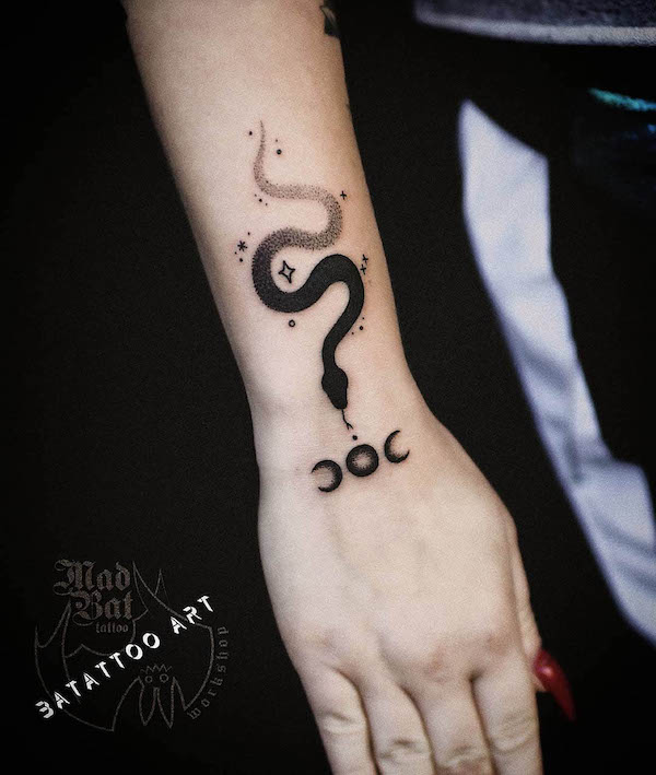 Snake and star wrist tattoo by @batattoo_art