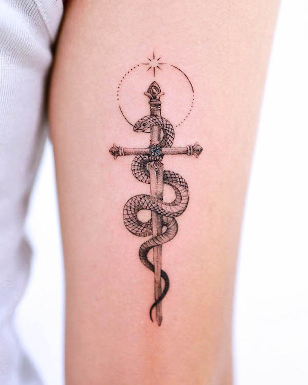 Snake and sword tattoo by @tattooist_gaon