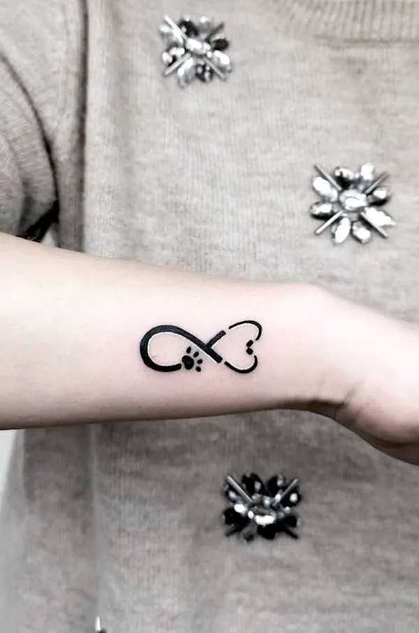 Stethoscope and infinity symbol tattoo by @nikita.tattoo