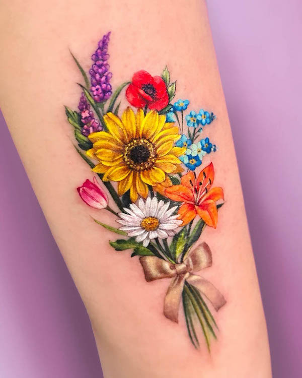 Stunning flower bouquet tattoo by @mar.tatuadora