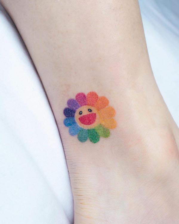 Super cute rainbow flower ankle tattoo by @keenetattoo