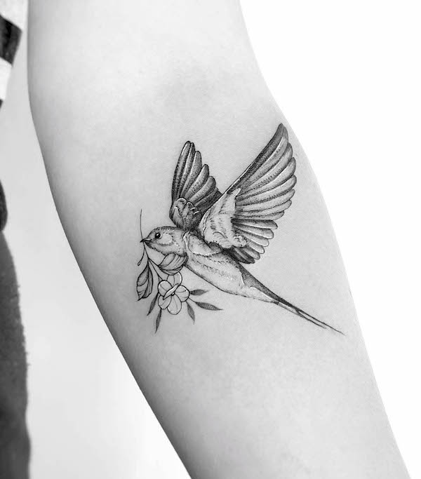 Swallow and flowers tattoo by @brittany_tattoo