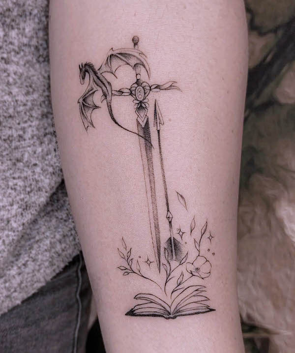 Sword and arrow tattoo by @ruscellipaola