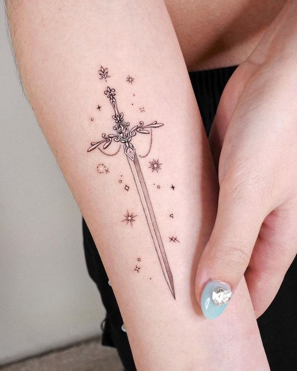 Sword and star tattoo by @tattooist_solar