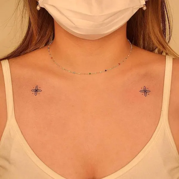 Symmetrical ornamental collarbone tattoos by @tattooer_jina