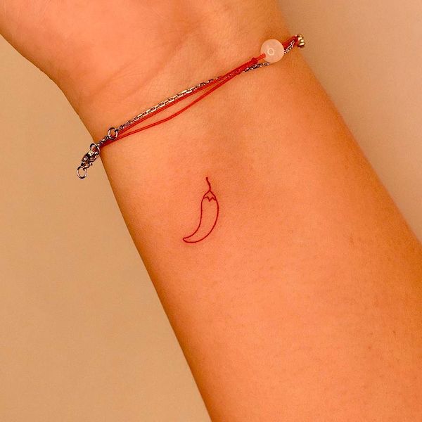 Tiny chilly wrist tattoo by @tattooer_jina