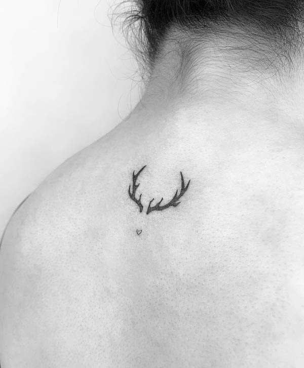 Tiny deer antler tattoo by @th.tatoo