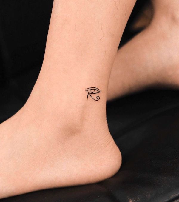 Tiny eye of Horus above the ankle tattoo by @nhi.ink