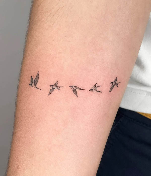 Tiny flying swallows by @xime.lizarazutattoo