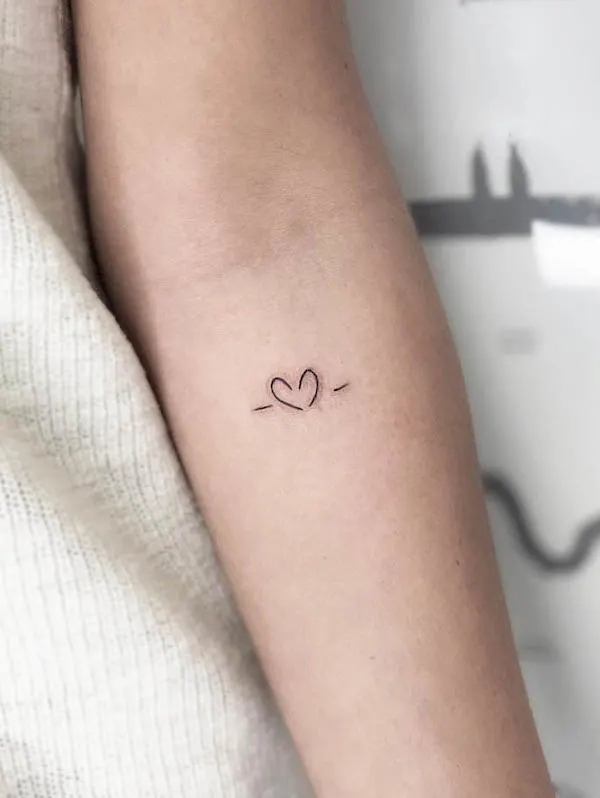 Tiny simple heart tattoo by @leorprice