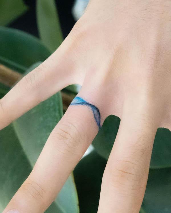 Tiny wave finger tattoo by @keenetattoo