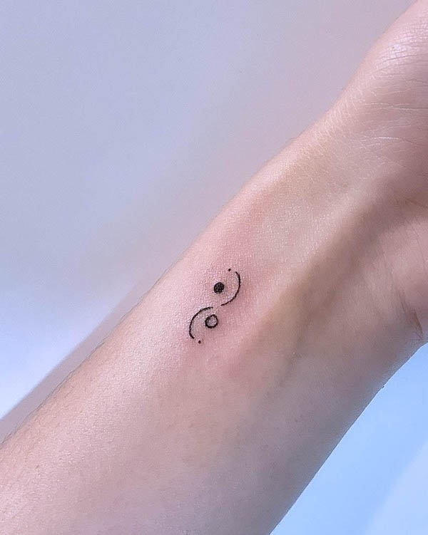 Tiny yin yang wrist tattoo by @9.tattoo