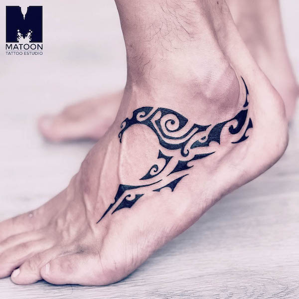 Tribal wave foot tattoo by @matoontattoo