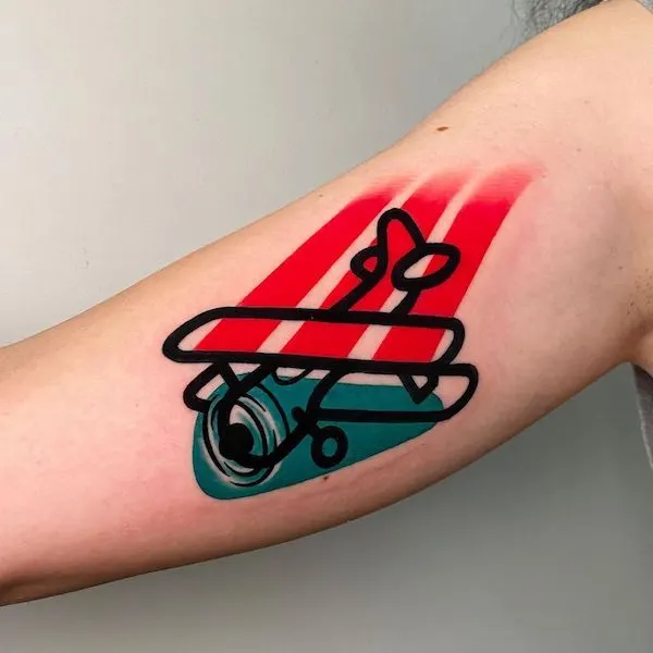 Two-color plane tattoo by @mambotattooer