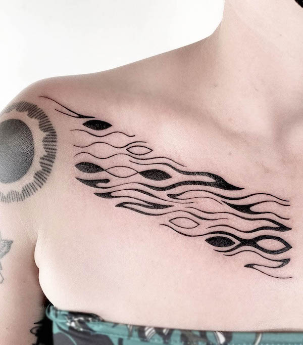 Water pattern under collarbone by @mothratattoo