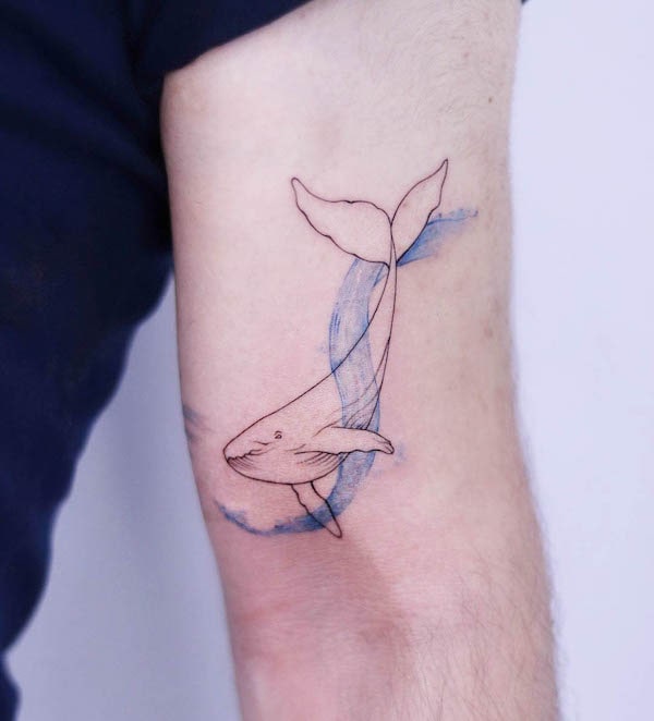 Watercolor wave and whale tattoo by @citlo.ink