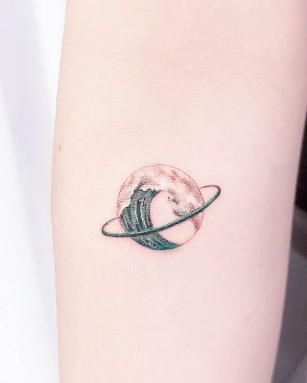 Wave planet tattoo by @vanilla__tattoo