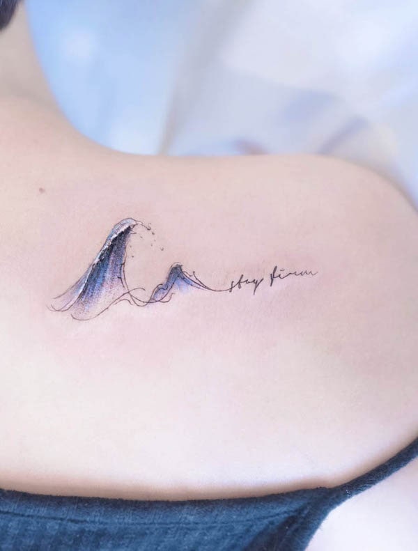 Wave with script tattoo by @heim__tattoo