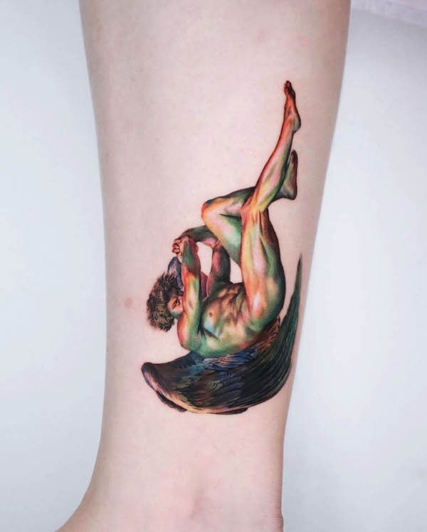 Whimsical colored fallen angel tattoo by @non_lee_ink