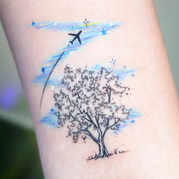 Whimsical tree and plane tattoo by @tattooist_namoo