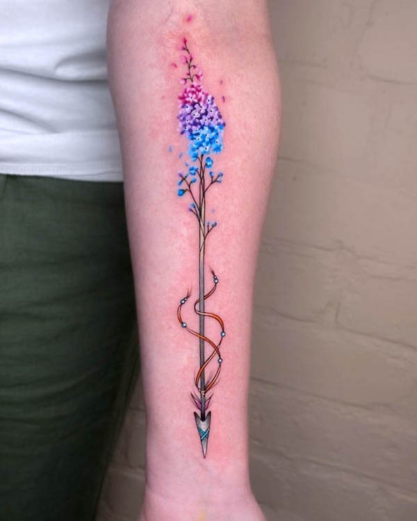 Whimsical watercolor arrow tattoo by @noemi_tattoo