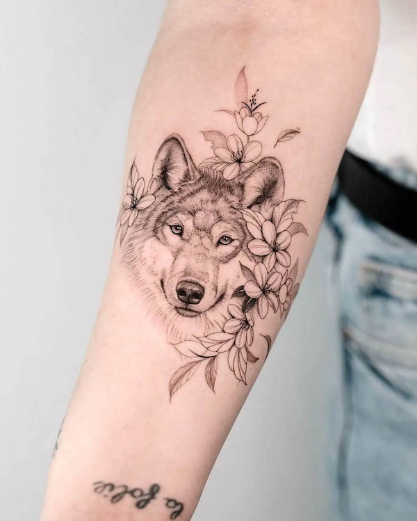 Wolf and cherry blossom tattoo by @la_source_tattoo