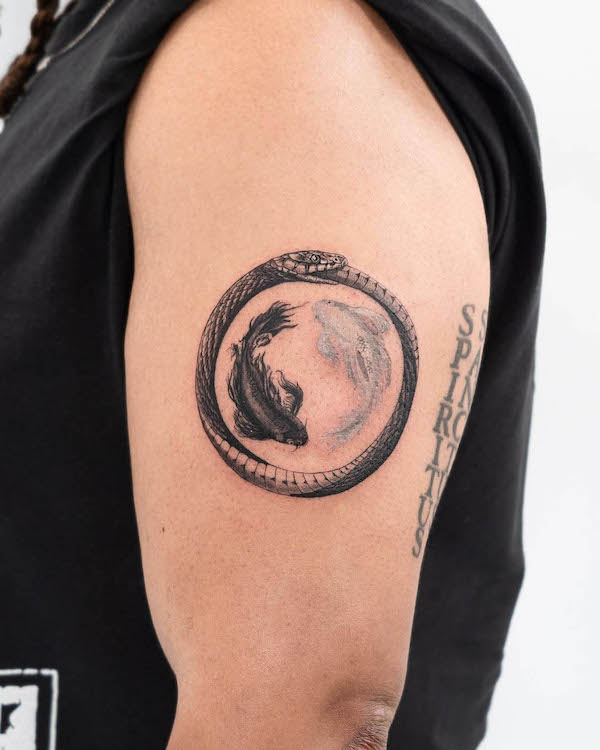 Yin yang koi fish and ouroborus tattoo by @mischieftattoonyc