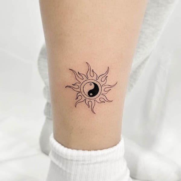 Yin yang sun tattoo by @lazybones_tattoo