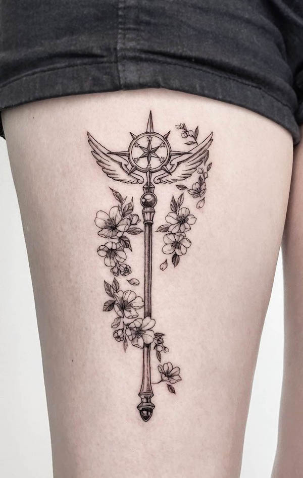 The magic scepter thigh tattoo by @paeonytattoo