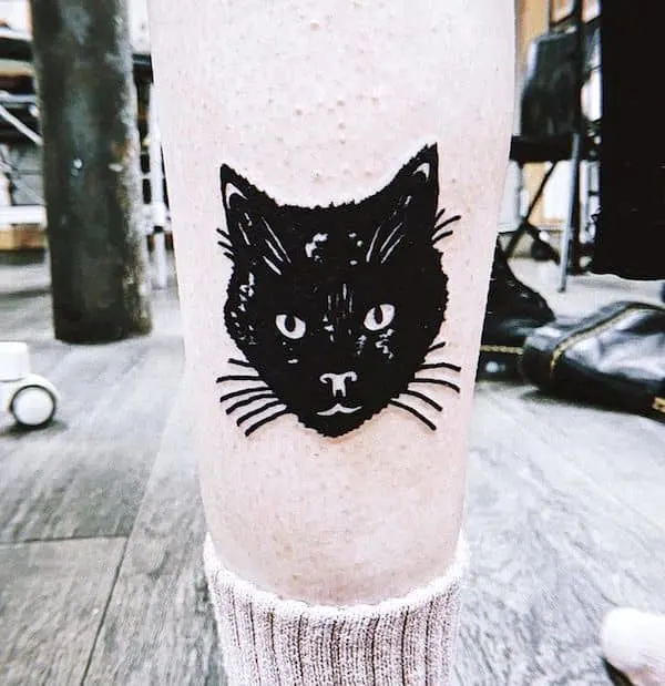 A black cat calf tattoo by @demondance- The Familiar animals tattoos for witches