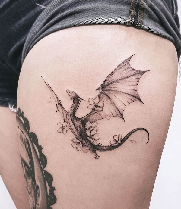 Floral dragon thigh tattoo by @baronarttattoo