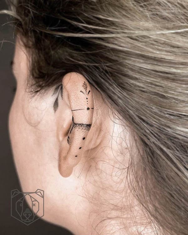 Ornament ear tattoo by @nikki_tattoo_art