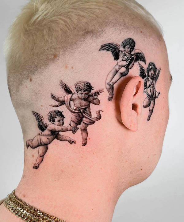 Baby angels around the ear tattoo by @delphinmusquet