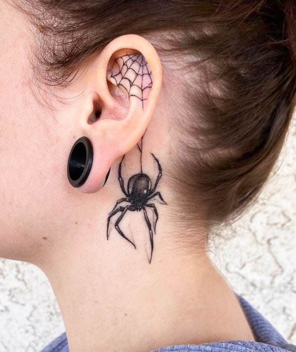 Spooky spider ear tattoo by @kenny7tattoo