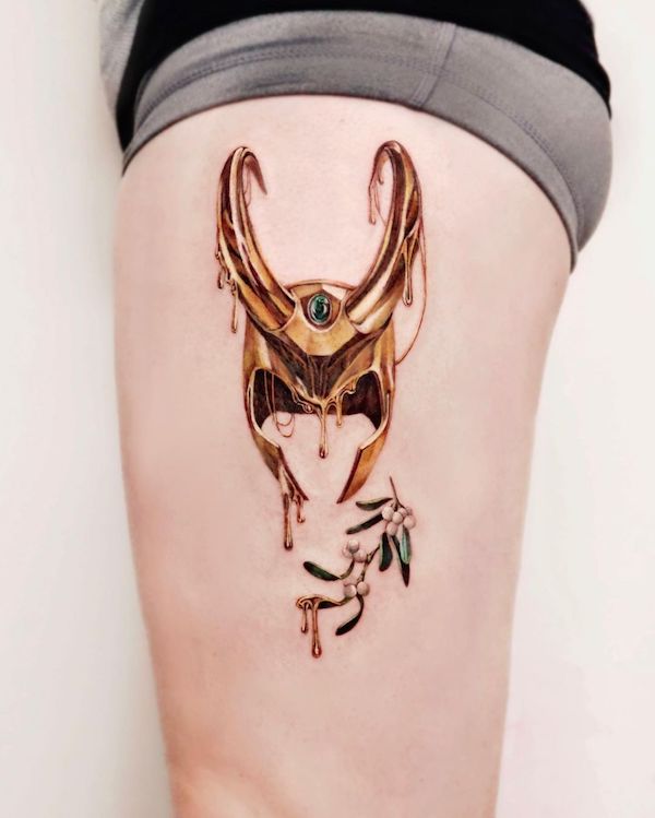 Loki's helmet and mistletoe flowers tattoo by @chou_ta_1