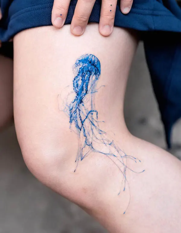 Stunning jellyfish thigh tattoo by @pokhy_tattoo
