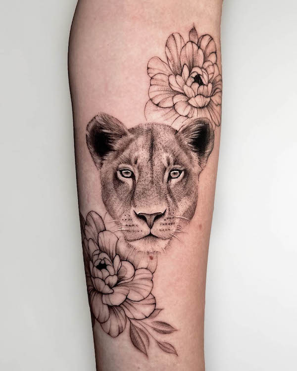 Floral lioness tattoo by @adaya_tatts