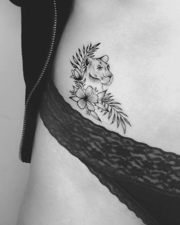 Lioness floral hip tattoo by @hollieink_