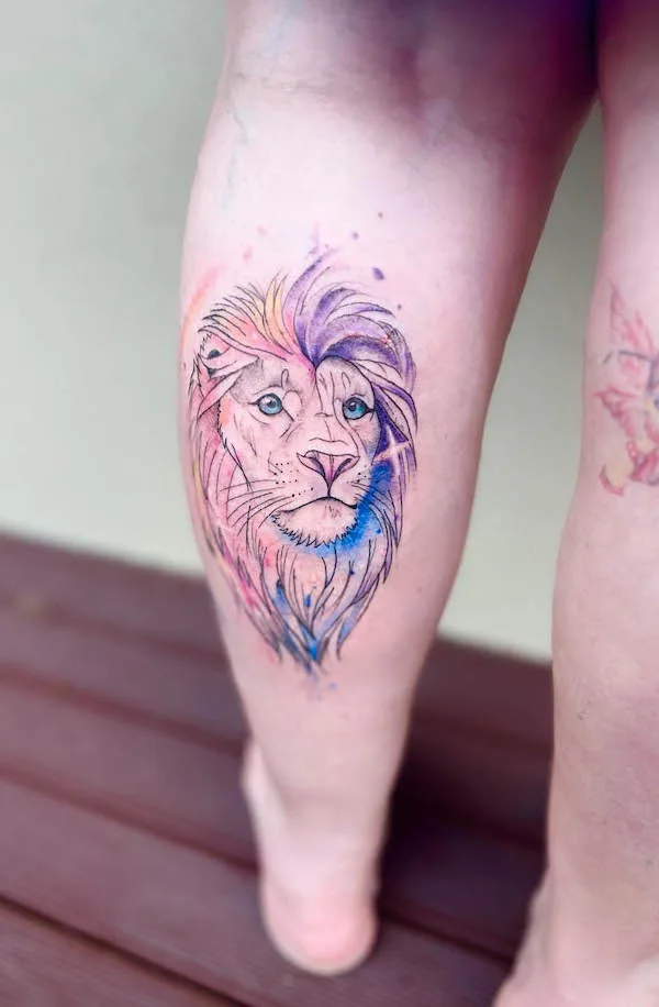 Watercolor lion calf tattoo by @inko2.0