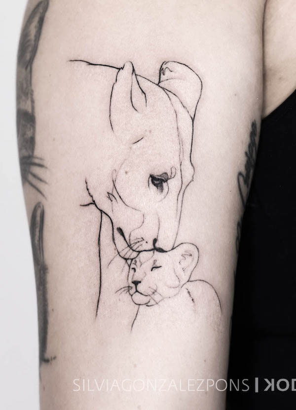 Fine line lioness and her cub tattoo by @kodiak_tattoo