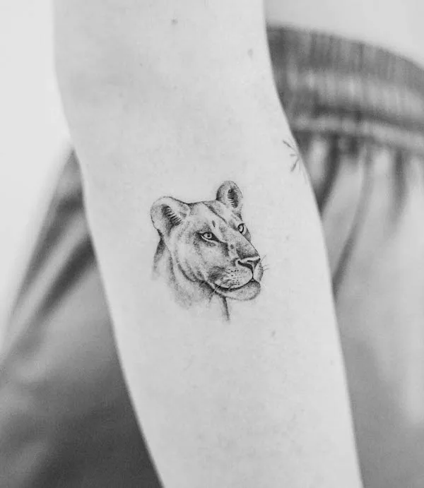 Simple lioness forearm tattoo by @lou_tattooartist